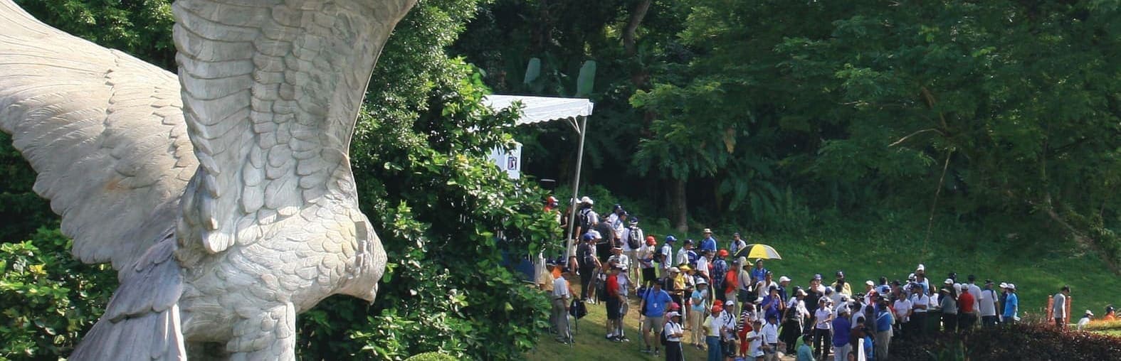 The club's eagle statue overlooking a fairway lined with tournament spectators