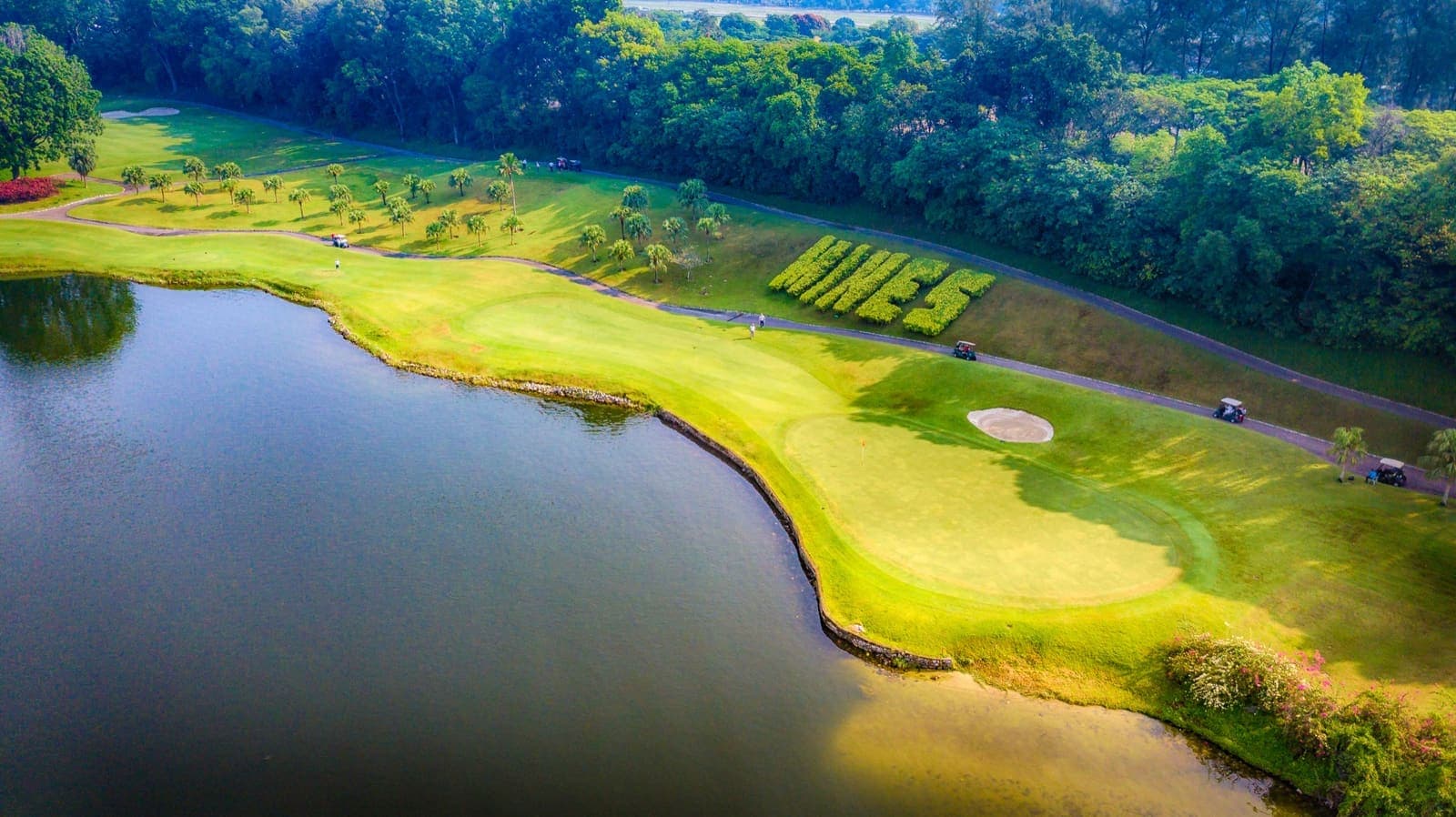Aerial view of the 18-hole championship course between the lake and the jungle