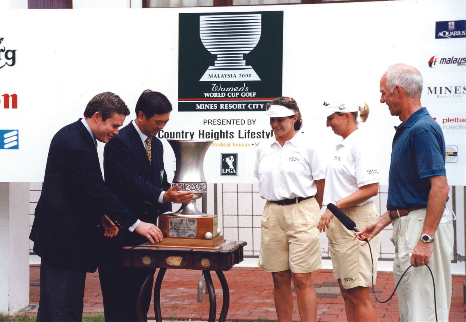 The trophy presentation for the Women's World Cup Golf 2000, hosted at The Mines Resort City, with LPGA players and event officials
