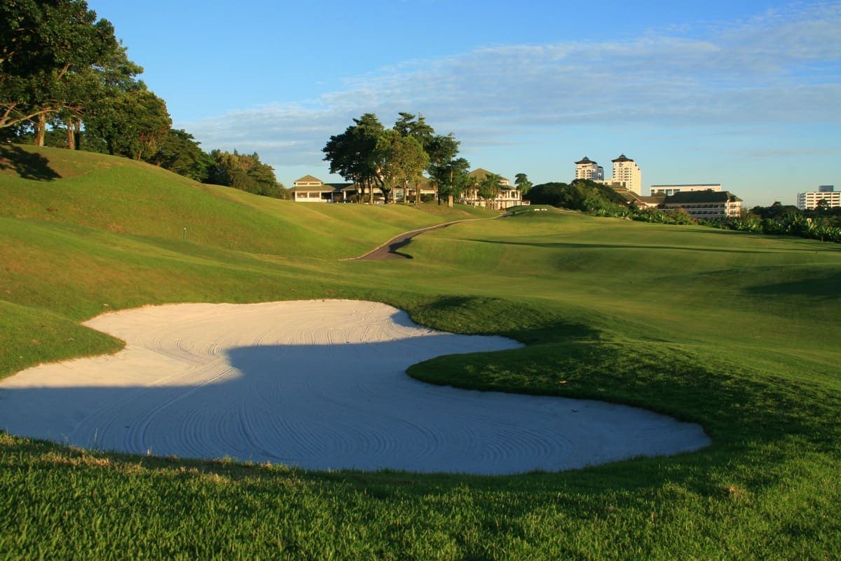 The par-3 11th hole, the club's Signature Hole, played across water toward a bunkered green